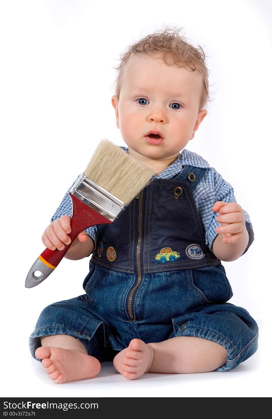 Beautiful baby with paint brush