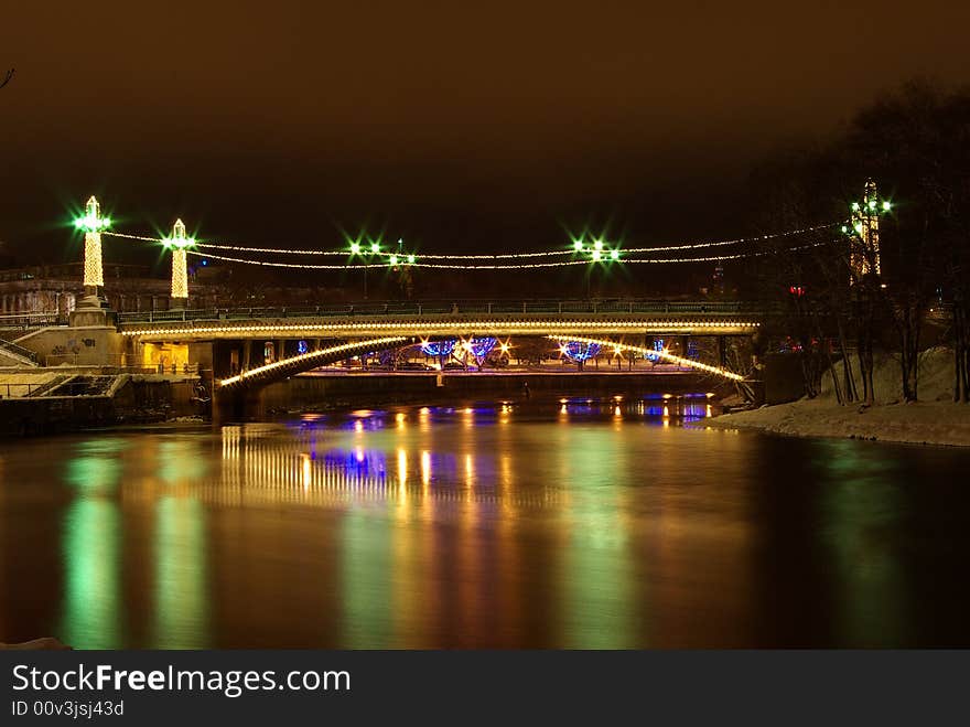 Bridge and reflections at night in Winter. Bridge and reflections at night in Winter