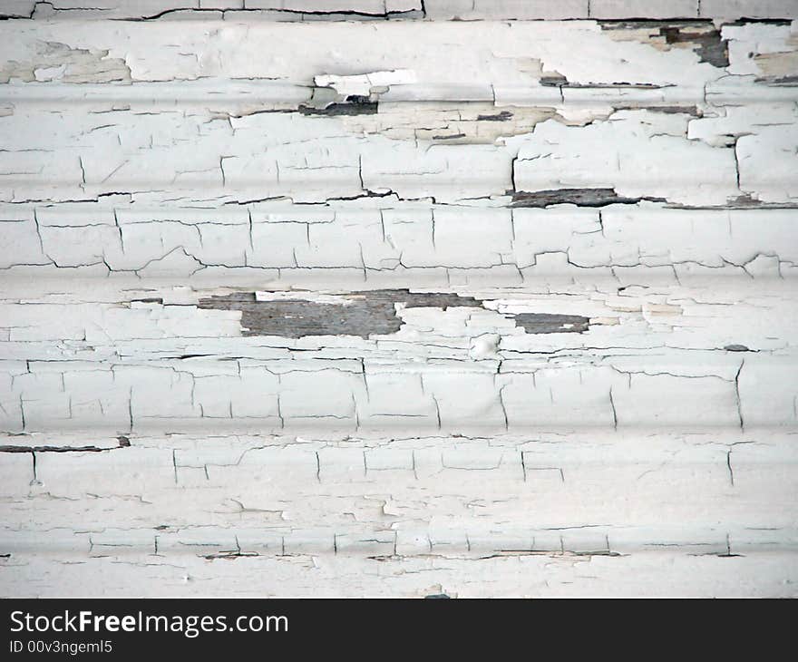 White cracked paint on old barn wood