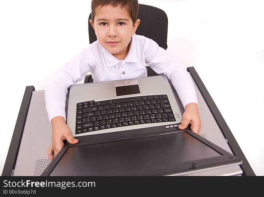 Portrait of cute caucasian boy with laptop over white. Portrait of cute caucasian boy with laptop over white