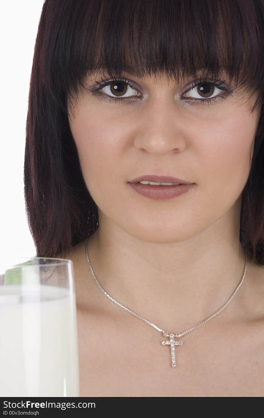 Woman with a glass of milk against a white background