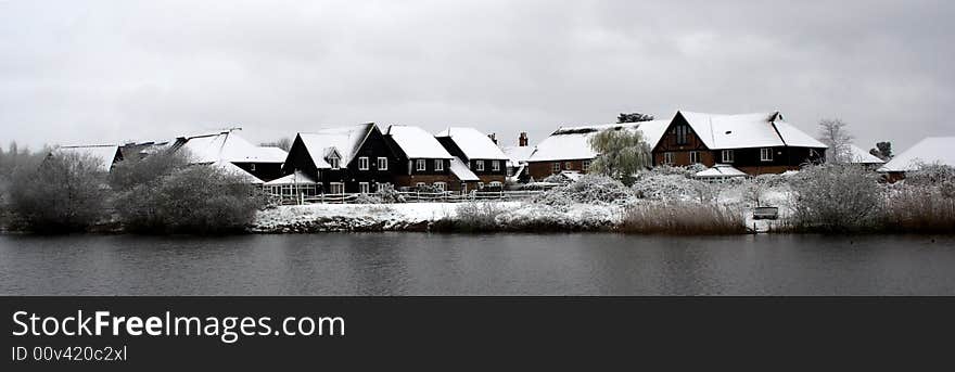 Snow covered rooftops next to the River Thames in Berkshire