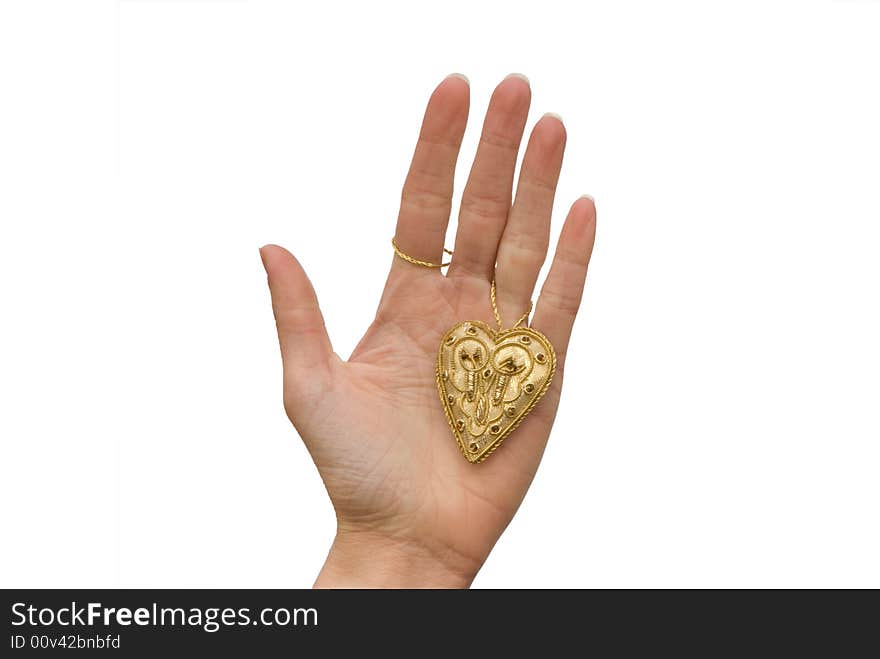 little gold  heart on the woman hand