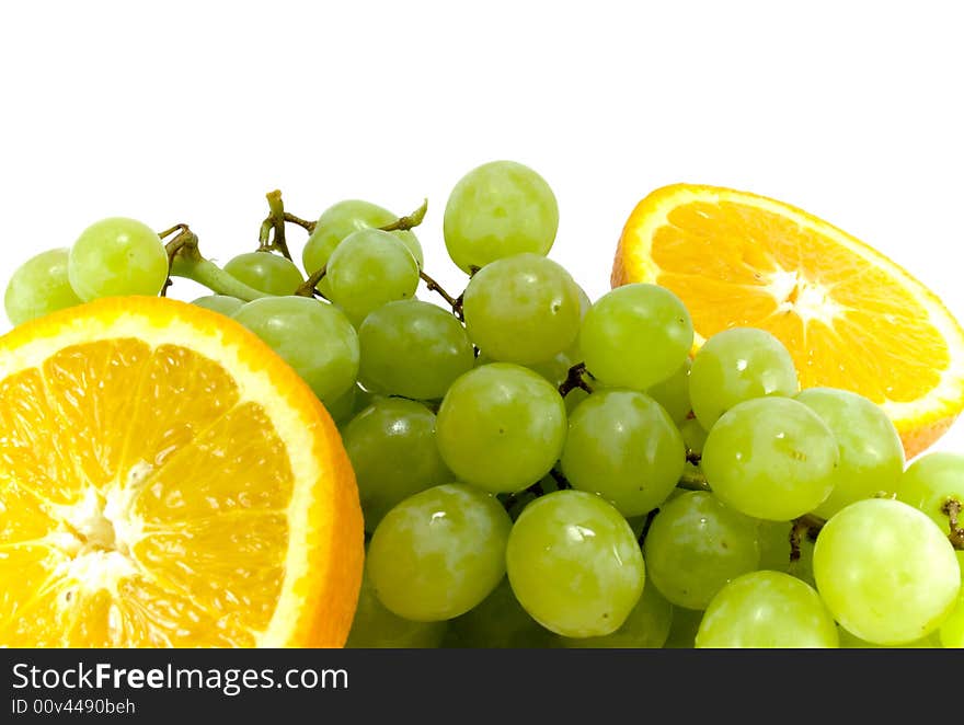 Grapes and two halfs of orange close-up