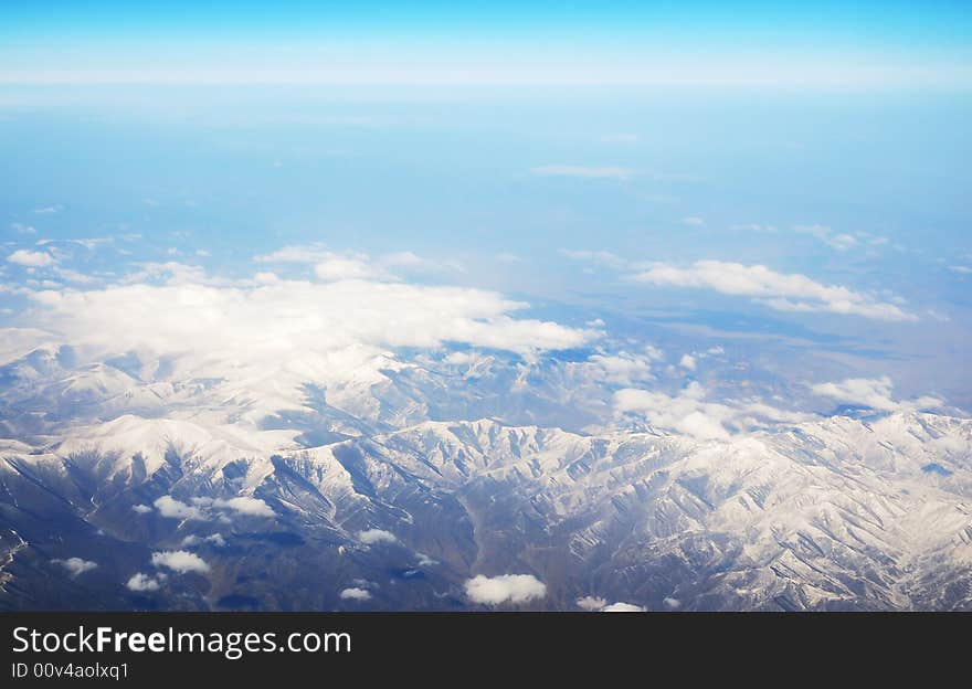 Beautiful snow mountain under clouds