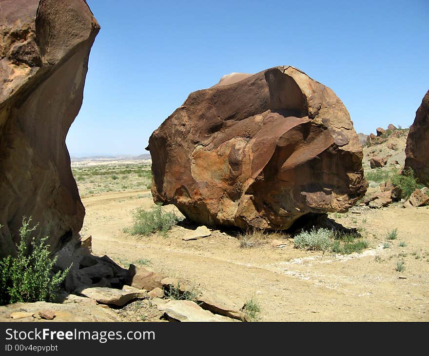 Boulder at the base of a mountain in Terlingua, Texas in the Chihuahuan desert near Big Bend National Park. Measures approximately 2 stories high. Boulder at the base of a mountain in Terlingua, Texas in the Chihuahuan desert near Big Bend National Park. Measures approximately 2 stories high.