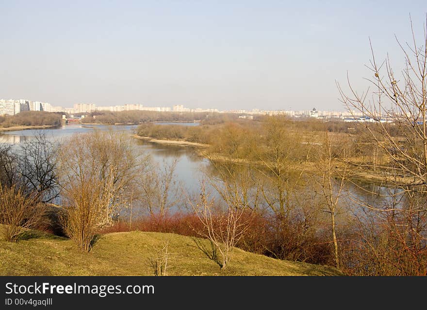 Coast of the river on a background of city