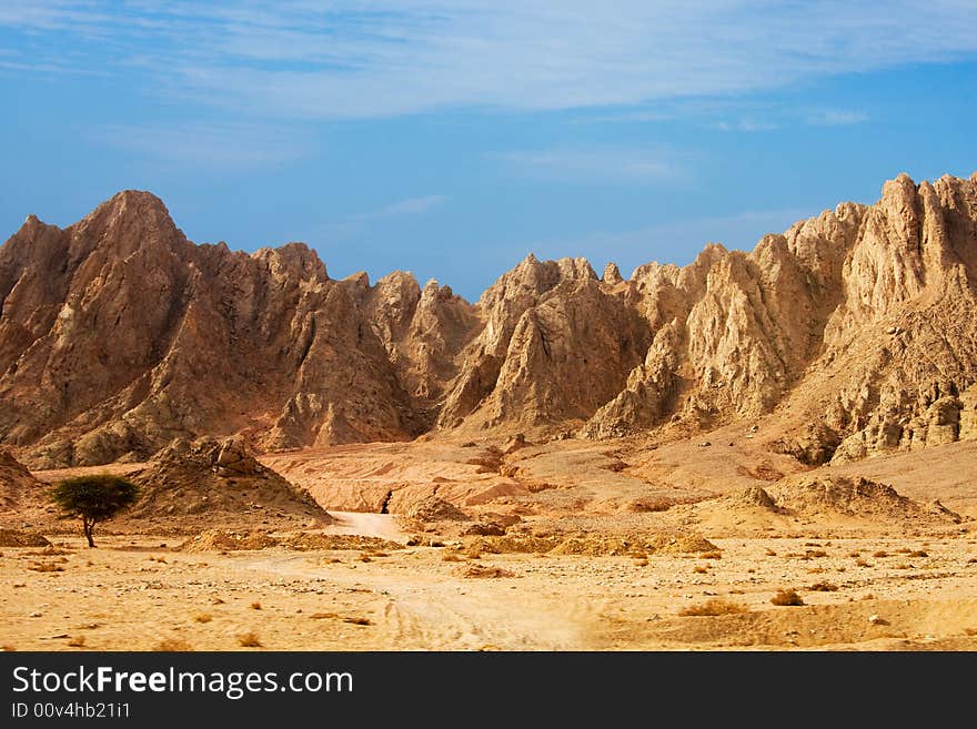 High mountains on a background of the dark blue sky