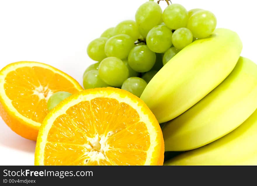 Grapes, bananas and two halves of orange