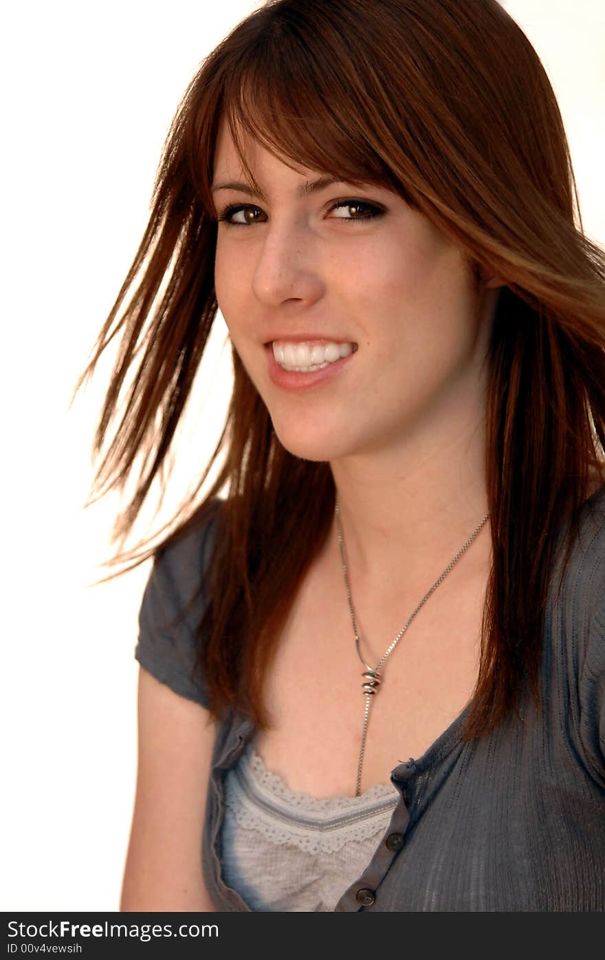 Portrait of a beautiful girl with big smile against white background. Portrait of a beautiful girl with big smile against white background.