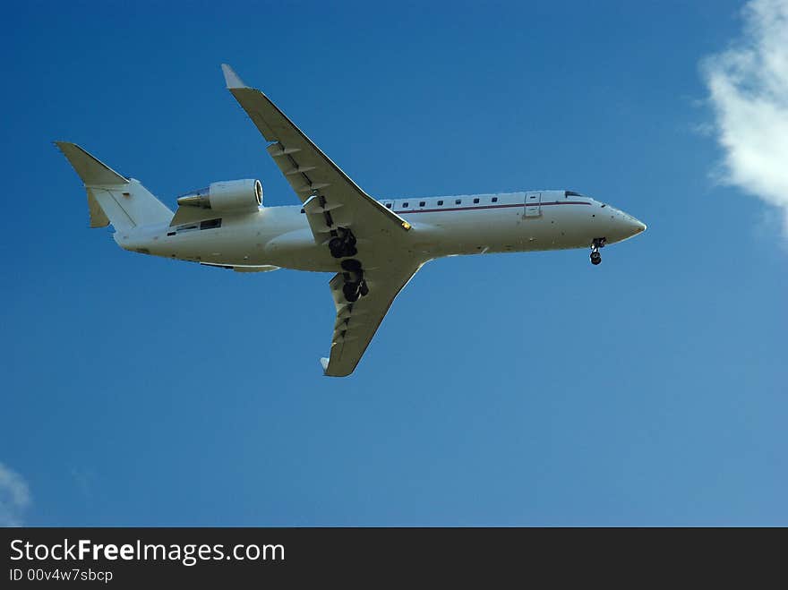 Aeroplane seen from ground on blue sky. Aeroplane seen from ground on blue sky