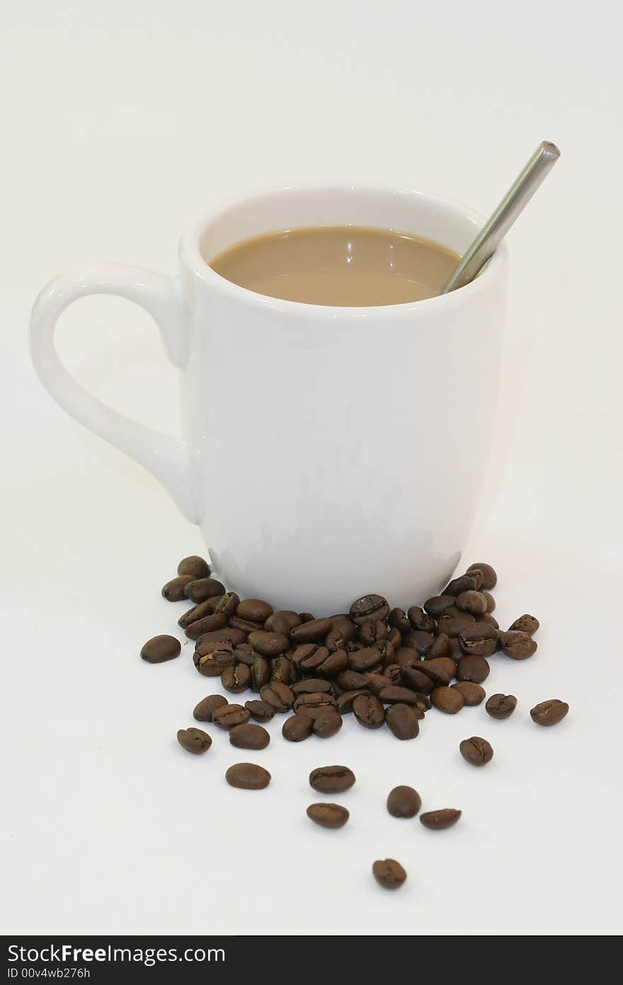 Cup of coffee on white background with a spoon. Cup of coffee on white background with a spoon