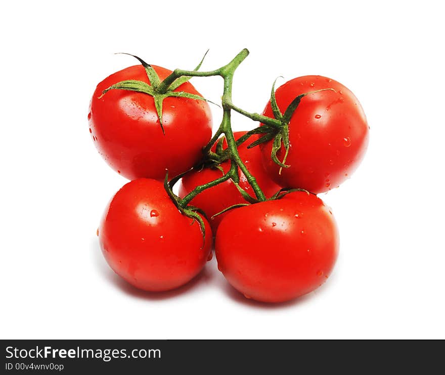 Five red tomatoes isolated on white