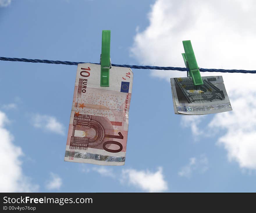 Euro banknotes hanging on laundry line. Euro banknotes hanging on laundry line