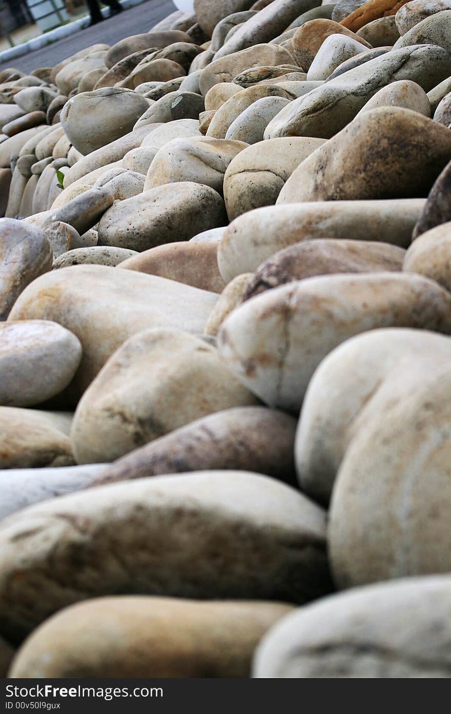 Many big grey stones at the seashore