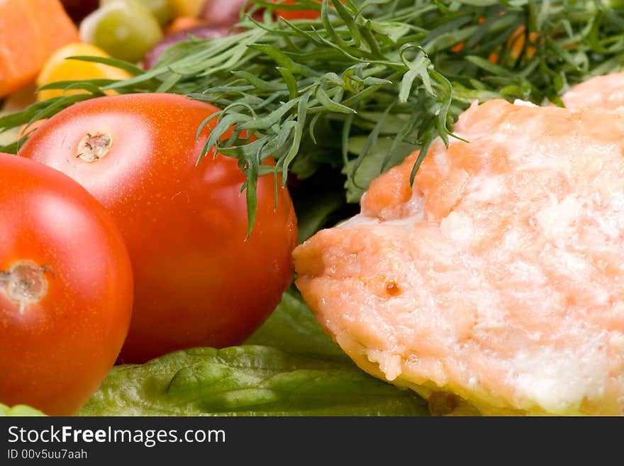 Stake from a salmon with vegetables on a plate