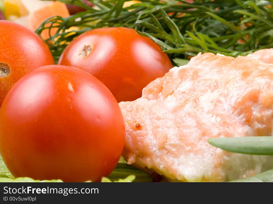 Stake from a salmon with vegetables on a plate