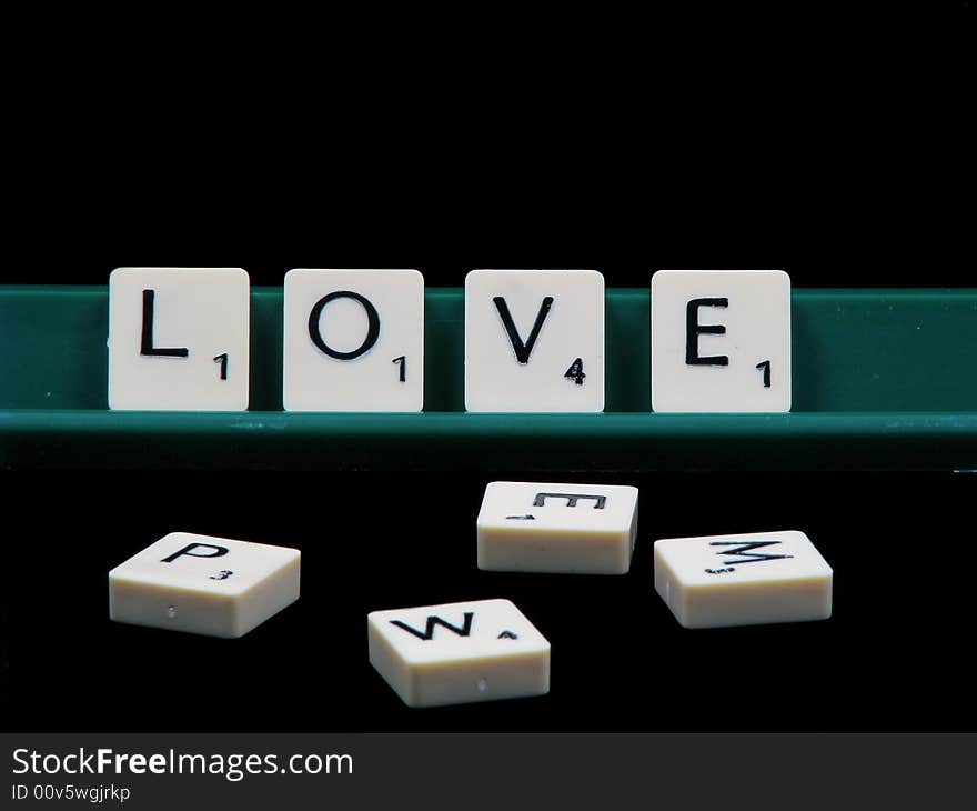 Letters spelling love with a black backround. Letters spelling love with a black backround