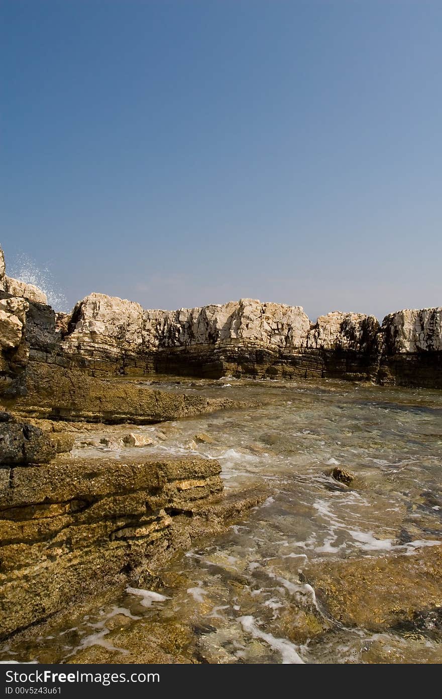 Hard rocks crumbled by the sea. Hard rocks crumbled by the sea