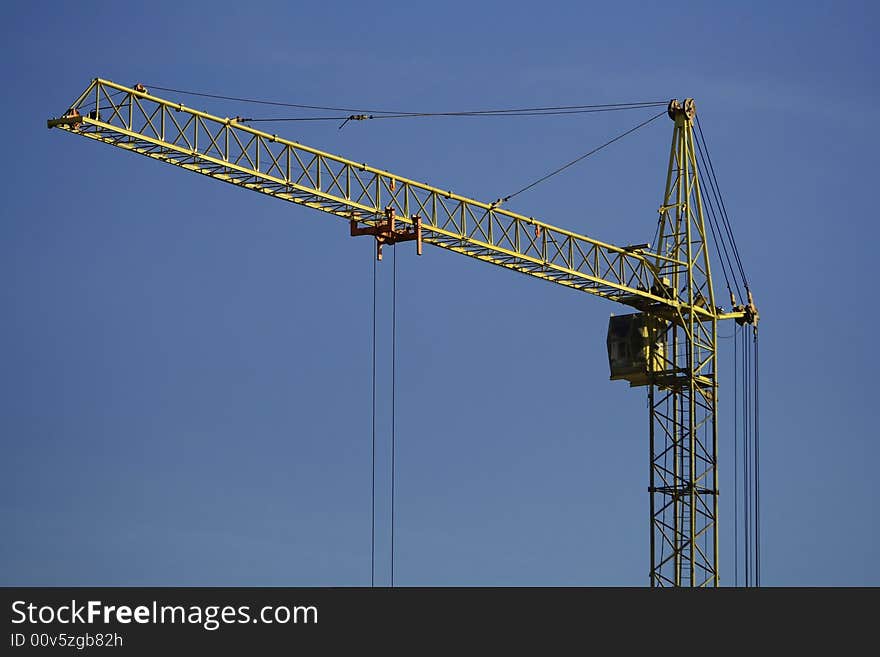 Building yellow crane in the sky. Building yellow crane in the sky