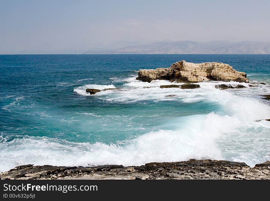 Sea waves dancing near Corfu island shore. Sea waves dancing near Corfu island shore