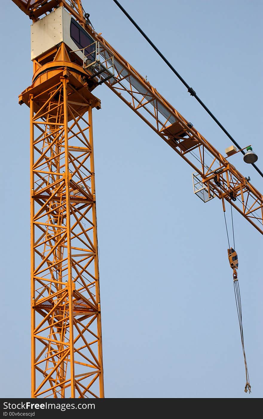 Lifting crane building the house on a construction site