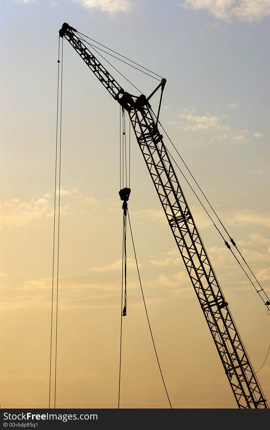 Lifting crane building the house on a construction site