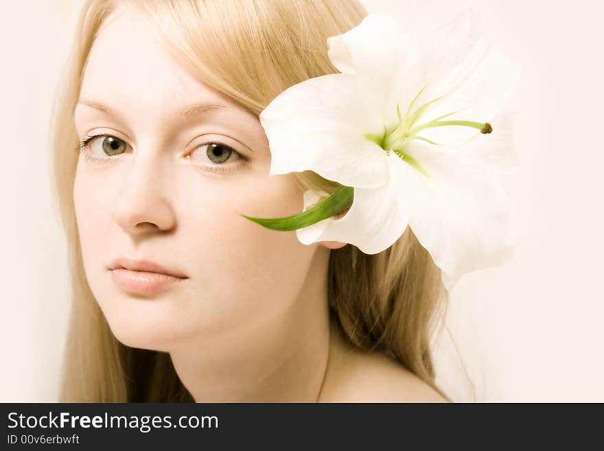 Young woman with white lily