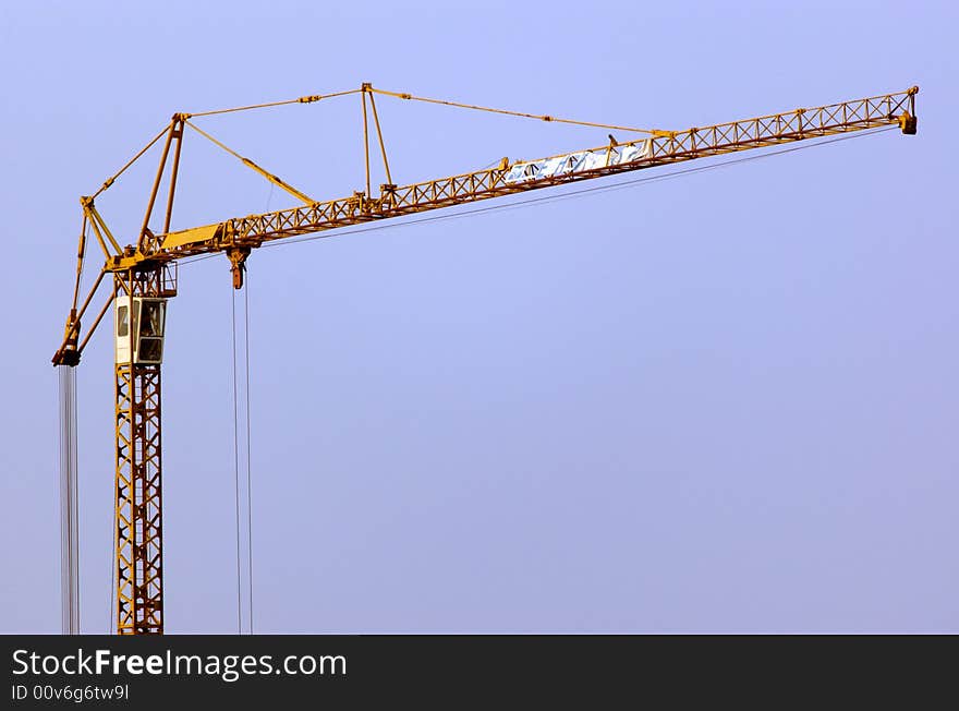 Lifting crane building the house on a construction site