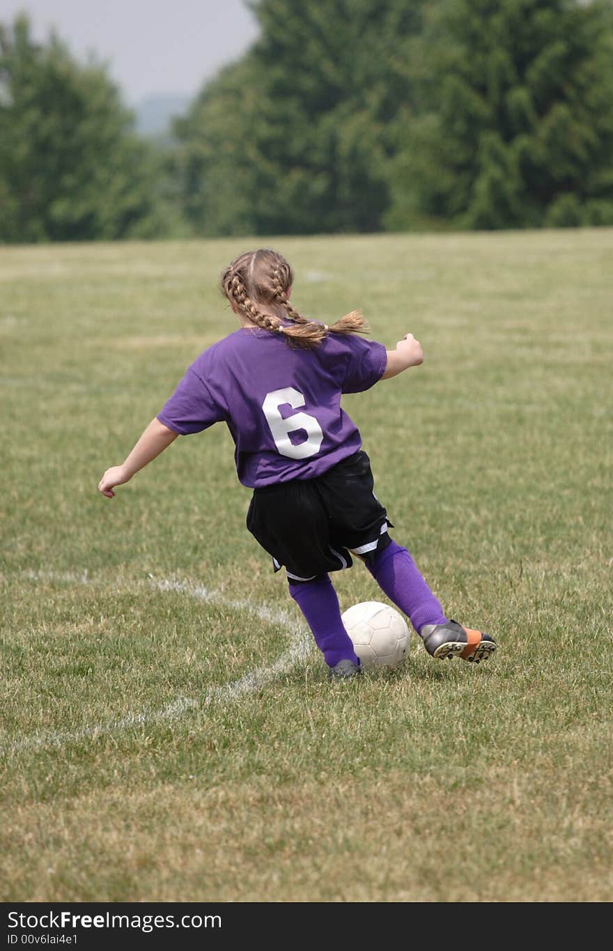 Youth Teen Soccer Player in Action during game. Youth Teen Soccer Player in Action during game.