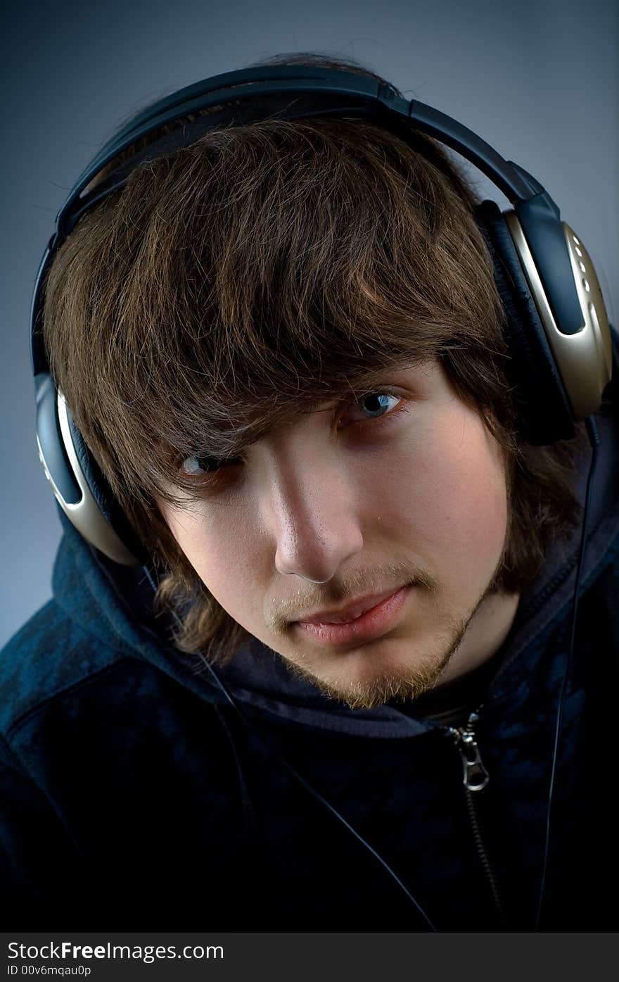 Young man listening to music with headphones. Young man listening to music with headphones