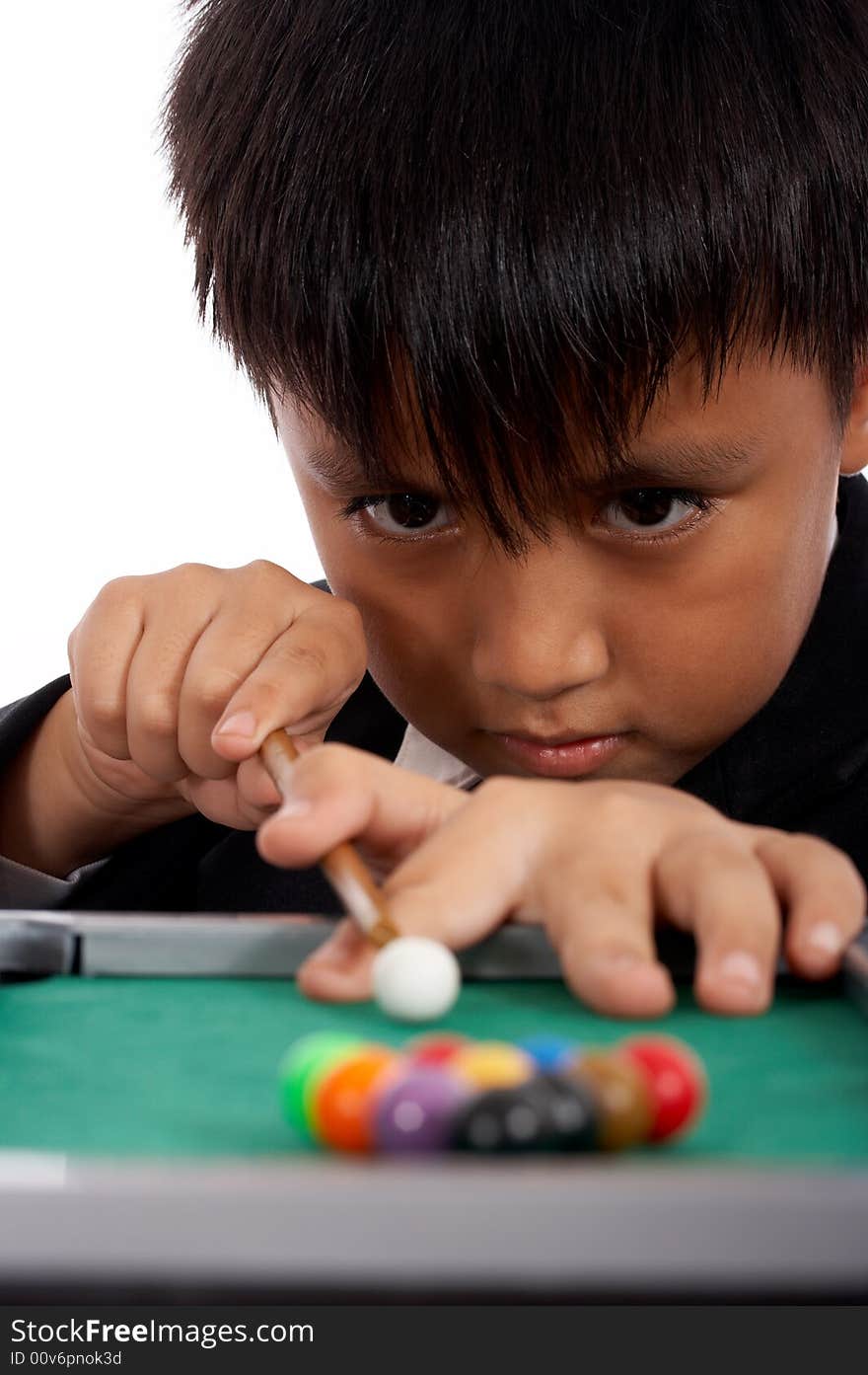 Attractive man concentrating at a pool playing billiards