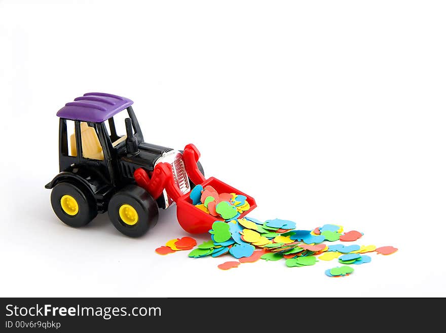 Toy tractor with coloured paper apples. Toy tractor with coloured paper apples