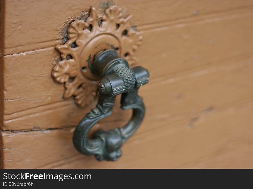 Old knob on a wooden door. Old knob on a wooden door