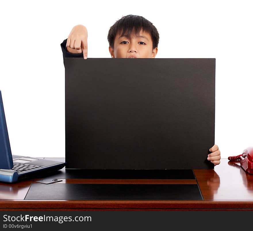 Child holding a blank black board showing off