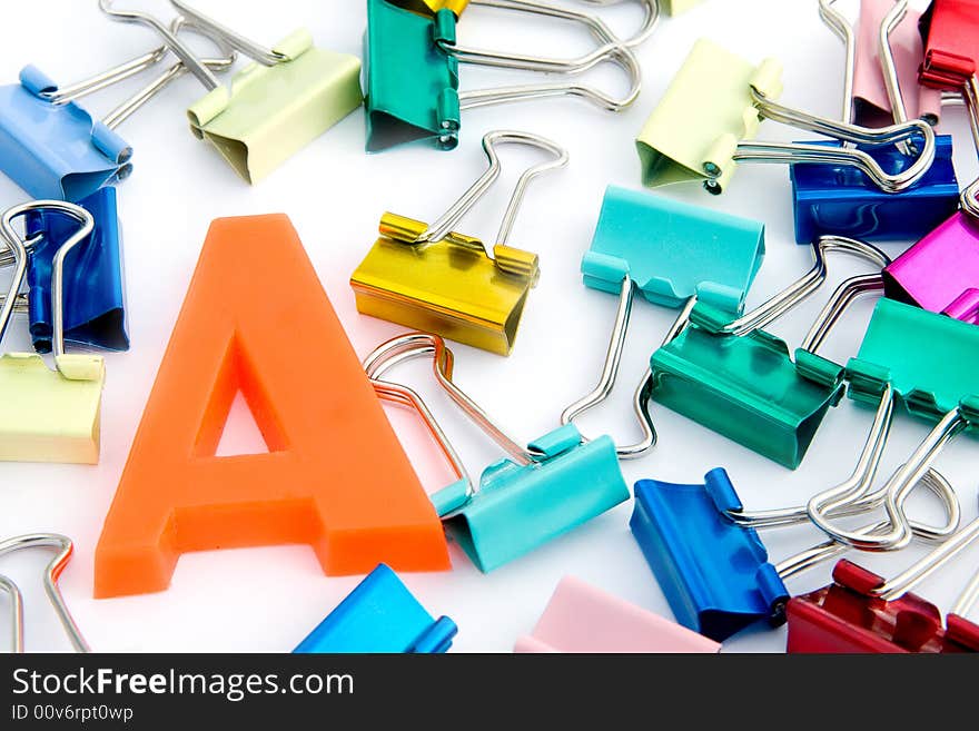 A letter with assorted coloured metal clips. A letter with assorted coloured metal clips