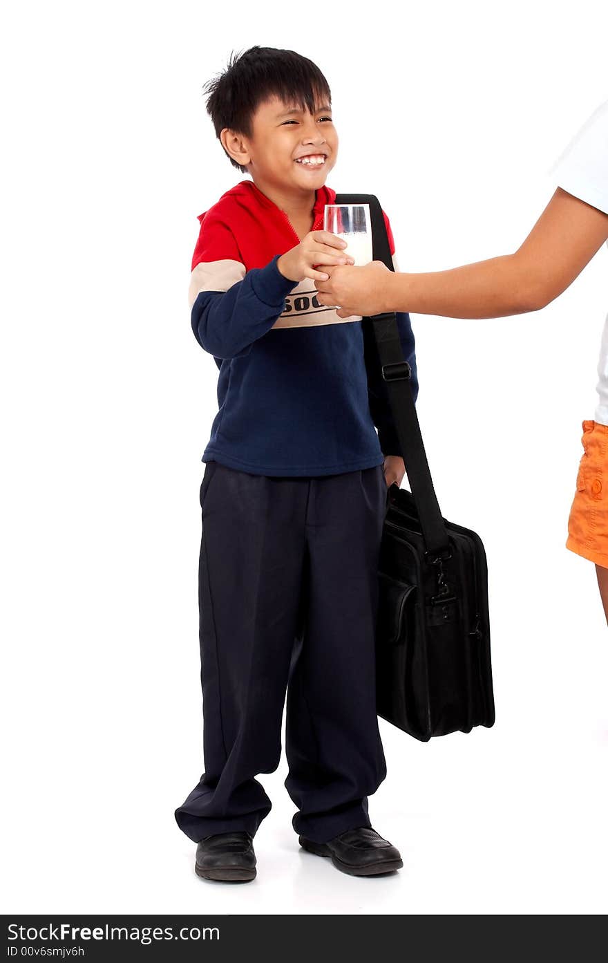 Adorable yound man holding a glass of milk. Adorable yound man holding a glass of milk