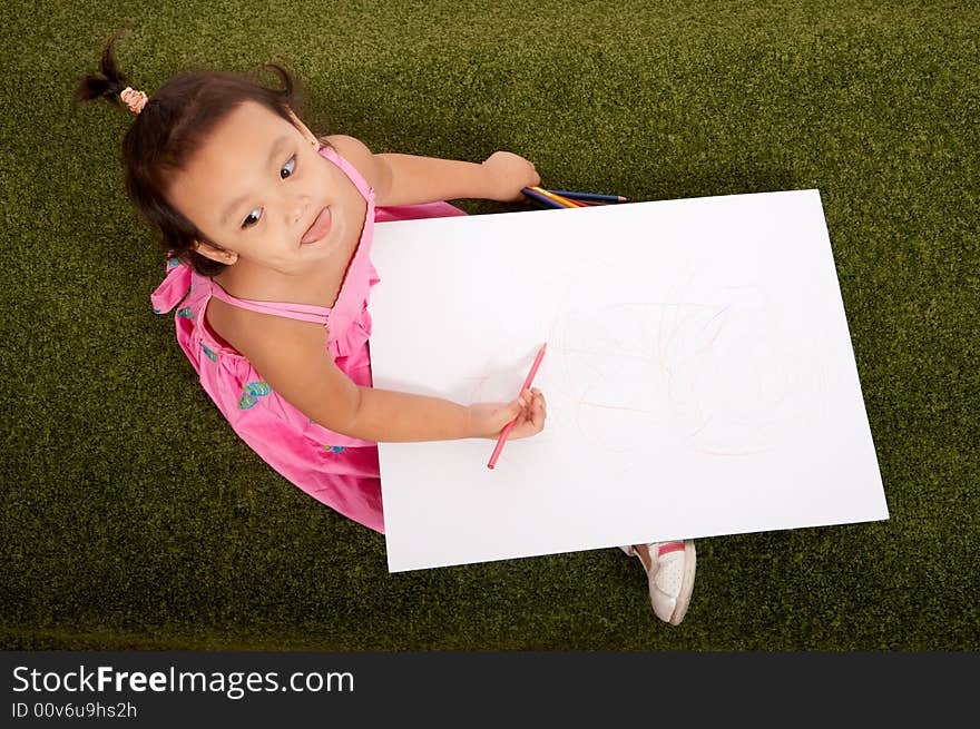 Little young girl sitting on the garden