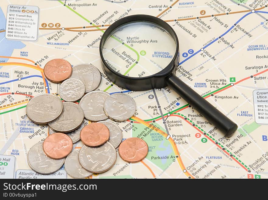 The map, coins and magnifier. The map, coins and magnifier