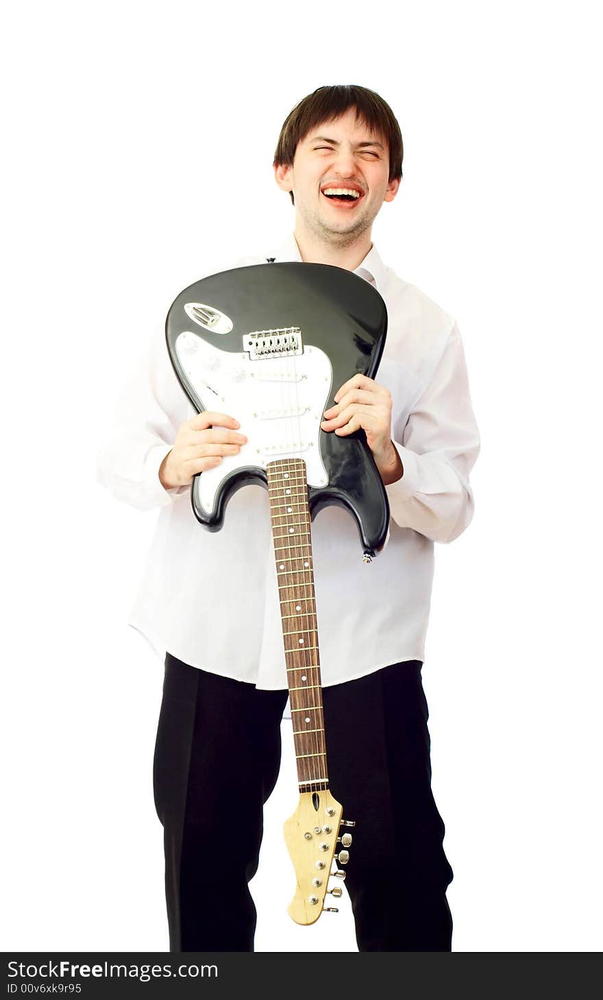 Young man with electric guitar over white. Young man with electric guitar over white