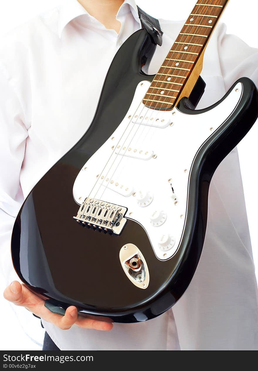 Electric guitar in hands over white