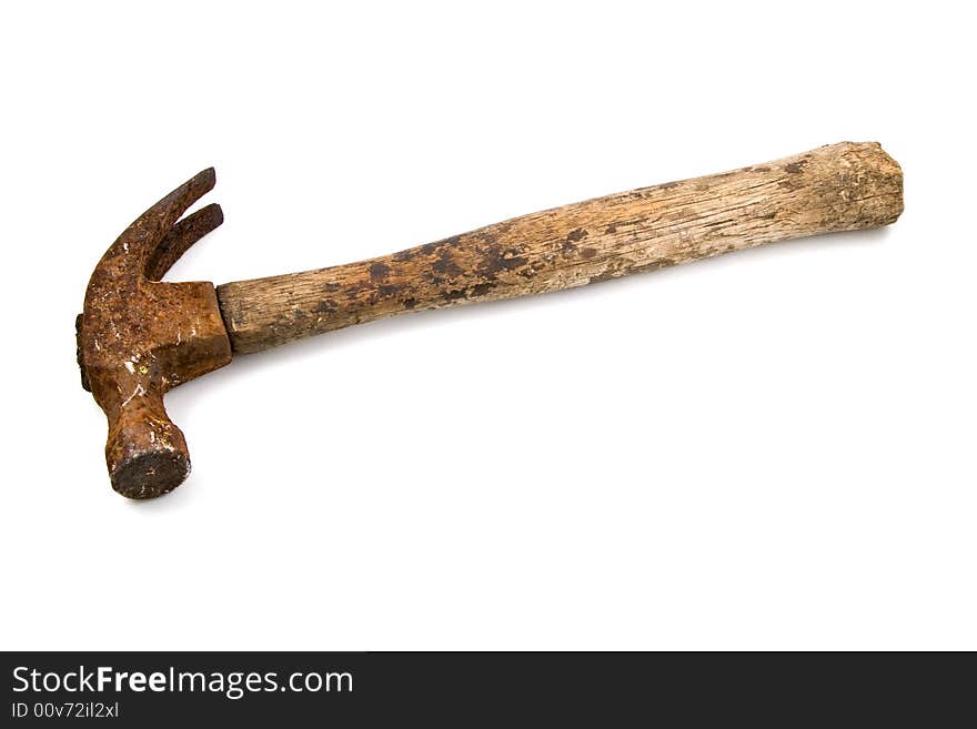 Battered old hammer with rusty claw and weathered wooden handle, isolated on a white background with clipping path included.