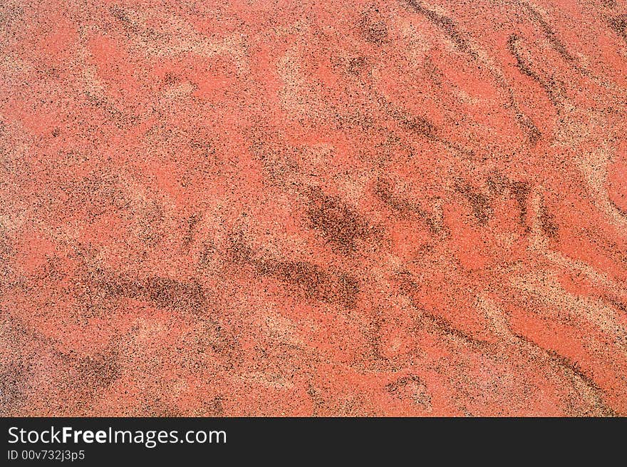 Red sand particular background/texture. Red sand particular background/texture.