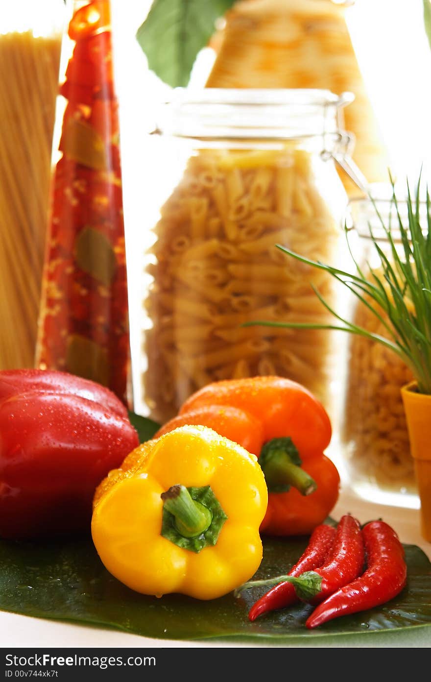 Still life with peppers in front of window