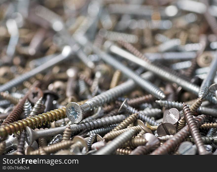 A selection of screws of various types and sizes. A selection of screws of various types and sizes.