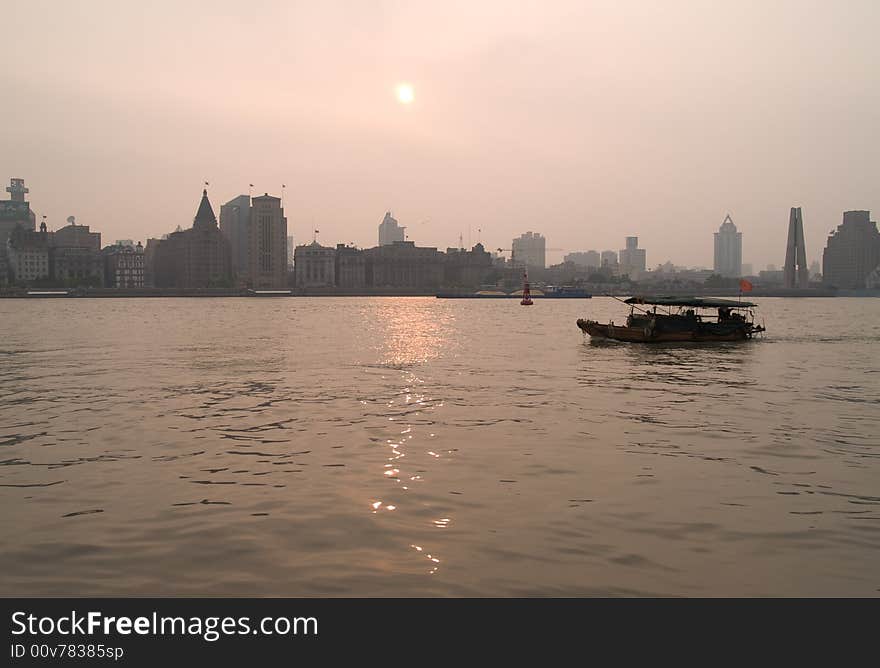 Boat In Shanghai At Sunset