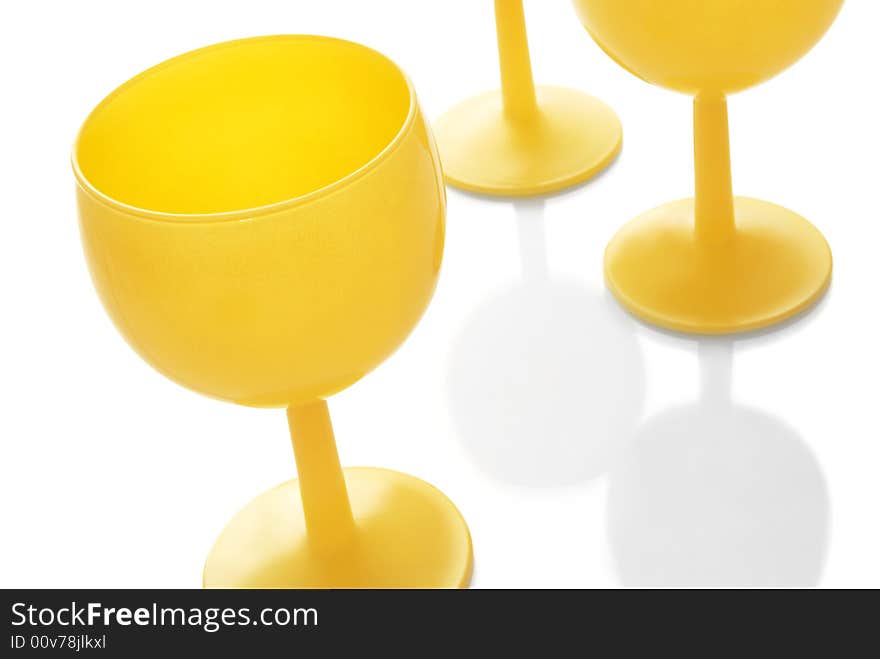 Three glasses on the white background. Focus is on one of the glass. Three glasses on the white background. Focus is on one of the glass.