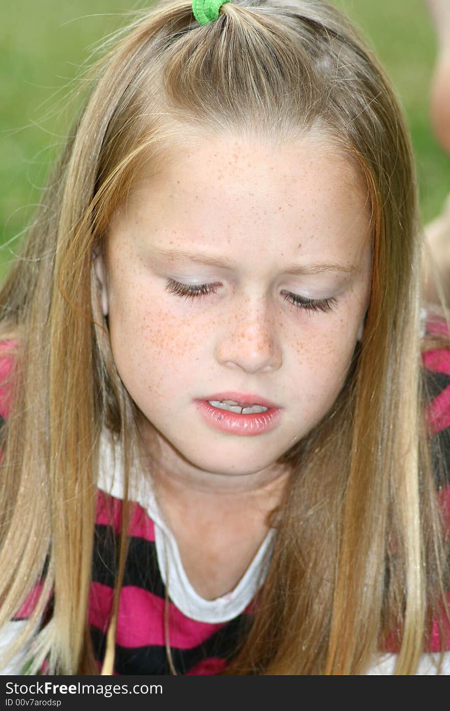 A white caucaisan girl child with an angry expression on her face. A white caucaisan girl child with an angry expression on her face