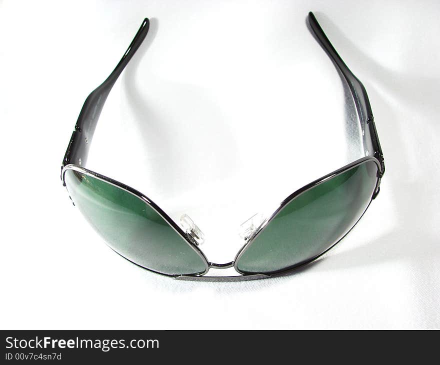 Dark green sunglasses isolated