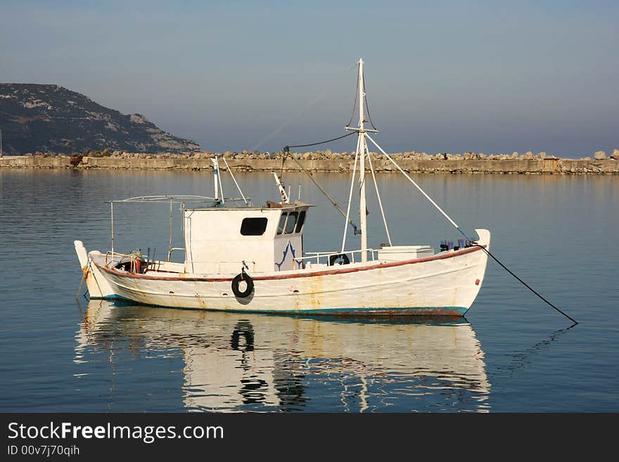 A lonely fishboat in the harbor